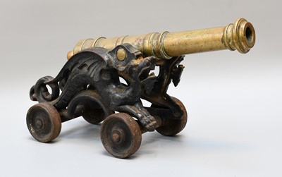 Lot 55 - A 19th Century Bronze Model Cannon, on iron...