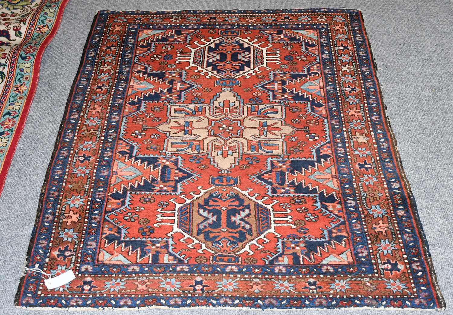 Lot 435 - Heriz Rug, the deep strawberry field centred