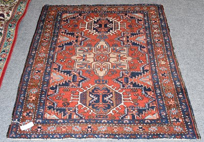 Lot 435 - Heriz Rug, the deep strawberry field centred...