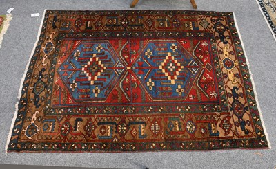 Lot 1119 - Heriz Rug, the field with two indigo hexagons...