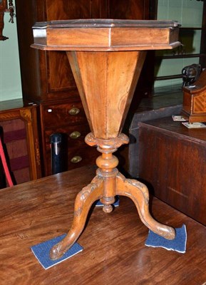 Lot 744 - An octagonal walnut work table