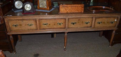 Lot 746 - An early 18th century oak sideboard with four frieze drawers, cross-banded and feathered inlay