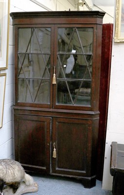 Lot 1387 - A George III Mahogany Glazed Standing Corner...