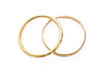 Lot 198 - A 9 Carat Gold Bangle, inner diameter 7.6cm;...