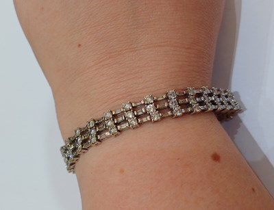 Lot 2262 - A Diamond Bracelet of brick link form, three...