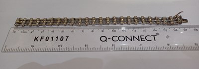 Lot 2262 - A Diamond Bracelet of brick link form, three...
