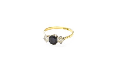 Lot 232 - A Sapphire and Diamond Three Stone Ring, the...