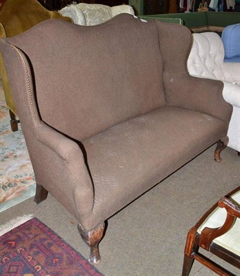 Lot 757 - An early 20th century camel or humpback sofa with dark brown upholstery