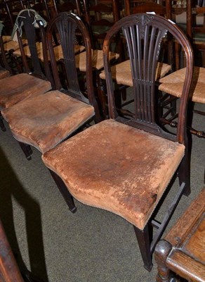 Lot 765 - A set of four Georgian mahogany dining chairs with leather top seats and serpentine front rails