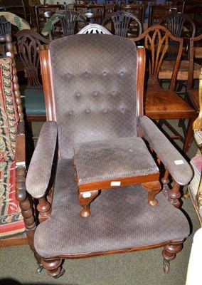 Lot 769 - An Edwardian upholstered armchair with matching footstool