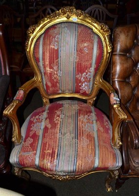 Lot 770 - A French style giltwood armchair with carved supports and arms