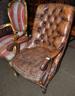 Lot 771 - Brown leather armchair