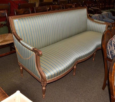 Lot 776 - A reproduction French style gilt wood settee with striped blue and gold upholstery and...