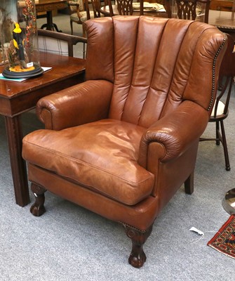 Lot 1377 - A Mahogany Framed Brown Leather Armchair, on...