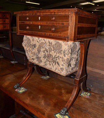 Lot 794 - A Regency rosewood sewing table with boxwood beading and two frieze drawers, on four out swept feet