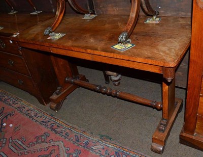 Lot 795 - A George IV rosewood library table with pull-out frieze drawer, lined with a gilt tooled back...