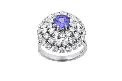 Lot 2260 - A Tanzanite and Diamond Cluster Ring the round...