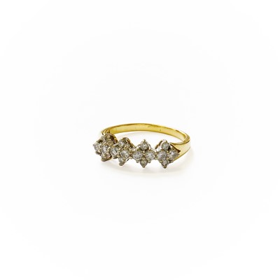 Lot 215 - An 18 Carat Gold Diamond Ring, comprising of...