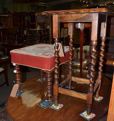 Lot 809 - An Edwardian oak bathroom cabinet with two mirrored panel doors, a dressing stool and an occasional