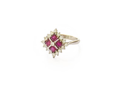 Lot 287 - A Ruby and Diamond Cluster Ring, the central...