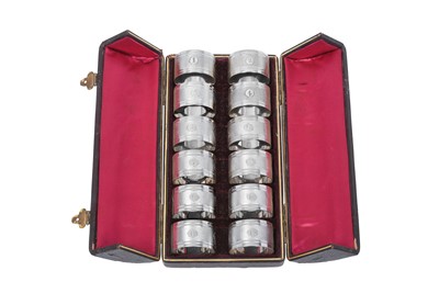 Lot 2108 - A Cased Set of Twelve Victorian or Edward VII Silver Plate Napkin-Rings