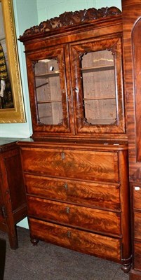 Lot 829 - A 19th century French walnut bookcase, with two glazed doors enclosing two shelves, over a...