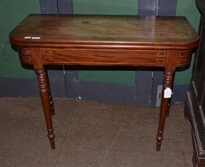 Lot 833 - A 19th century mahogany fold over tea table