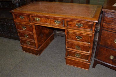 Lot 835 - A Leeny Jones reproduction burr walnut pedestal desk with gilded leather top