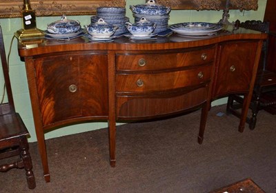 Lot 844 - Mahogany serpentine sideboard