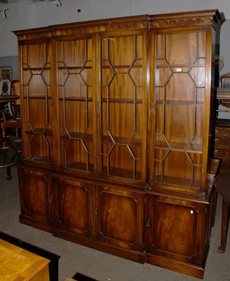 Lot 1243 - A Reproduction Mahogany Breakfront Library...