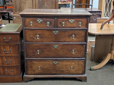 Lot 1281 - A George II Oak Chest of Drawers, crossbanded...