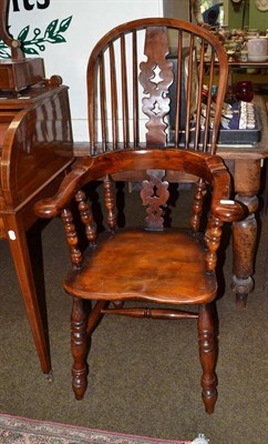 Lot 853 - A 19th century yew and elm Windsor chair with pierced and shaped splat