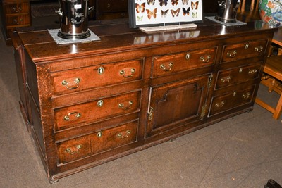 Lot 1277 - A George III Oak Dresser Base, crossbanded in...