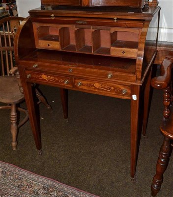 Lot 854 - An Edwardian inlaid mahogany cylinder top writing desk with marquetry decoration and pull out...