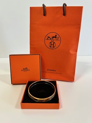 Lot Hermés Enamel Bangle printed in orange and...