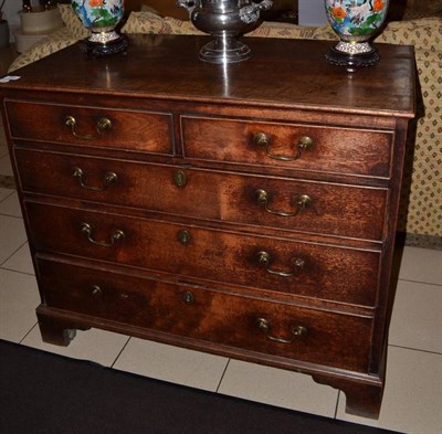 Lot 860 - A George III mahogany straight front chest of two short and three long graduated drawers, on...