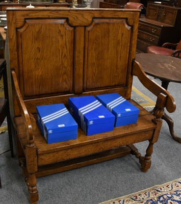 Lot 1339 - A 20th Century Oak Small Settle, the back with...