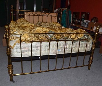 Lot 900 - A modern king size bed frame in Victorian style with mattress