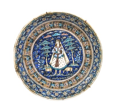 Lot 109 - A Qajar Fritware Dish, 19th century, painted...