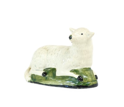 Lot 71 - A Cream Coloured Earthenware Model of a Sheep,...