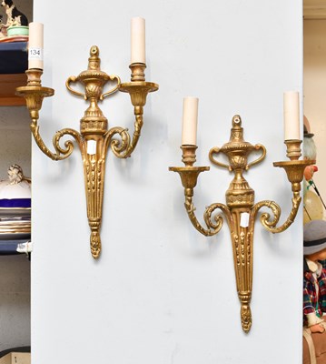 Lot 134 - A Pair of Gilt Brass Adams Style Twin Light...