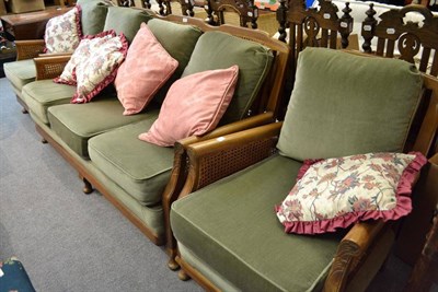 Lot 919 - A mid-20th century three piece bergere suite with loose cushions