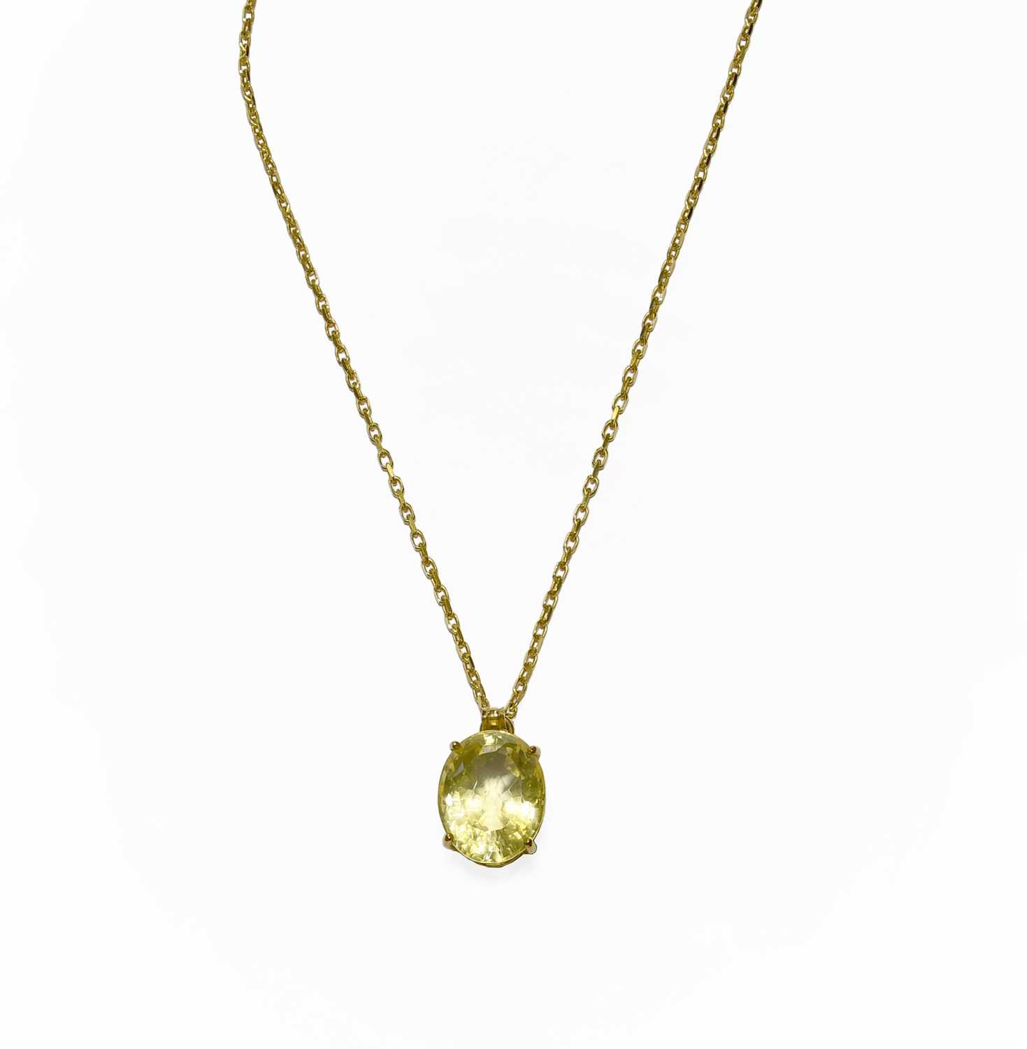 Lot 17 - A 9 Carat Gold Citrine Pendant on Chain, the...