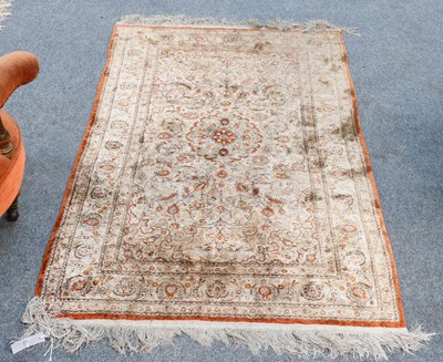 Lot 1090 - Modern Silk Rug, the ivory field of scrolling...