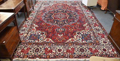 Lot 1093 - Bakhtiari Carpet, the faded blood red field...