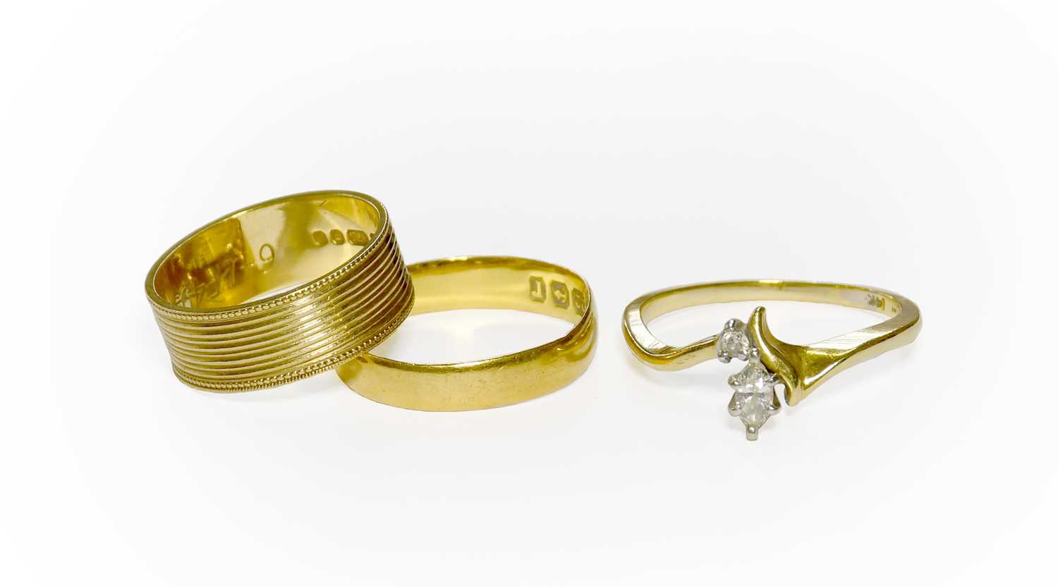 Lot 29 - A 22 Carat Gold Band Ring, finger size L; A 9...