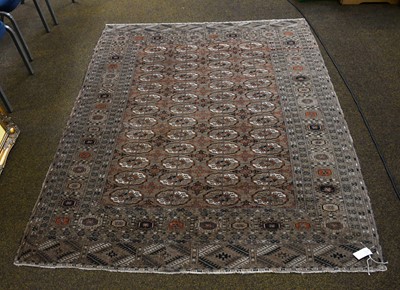 Lot 1006A - A Caucasian Rug, the fawn ground with four...