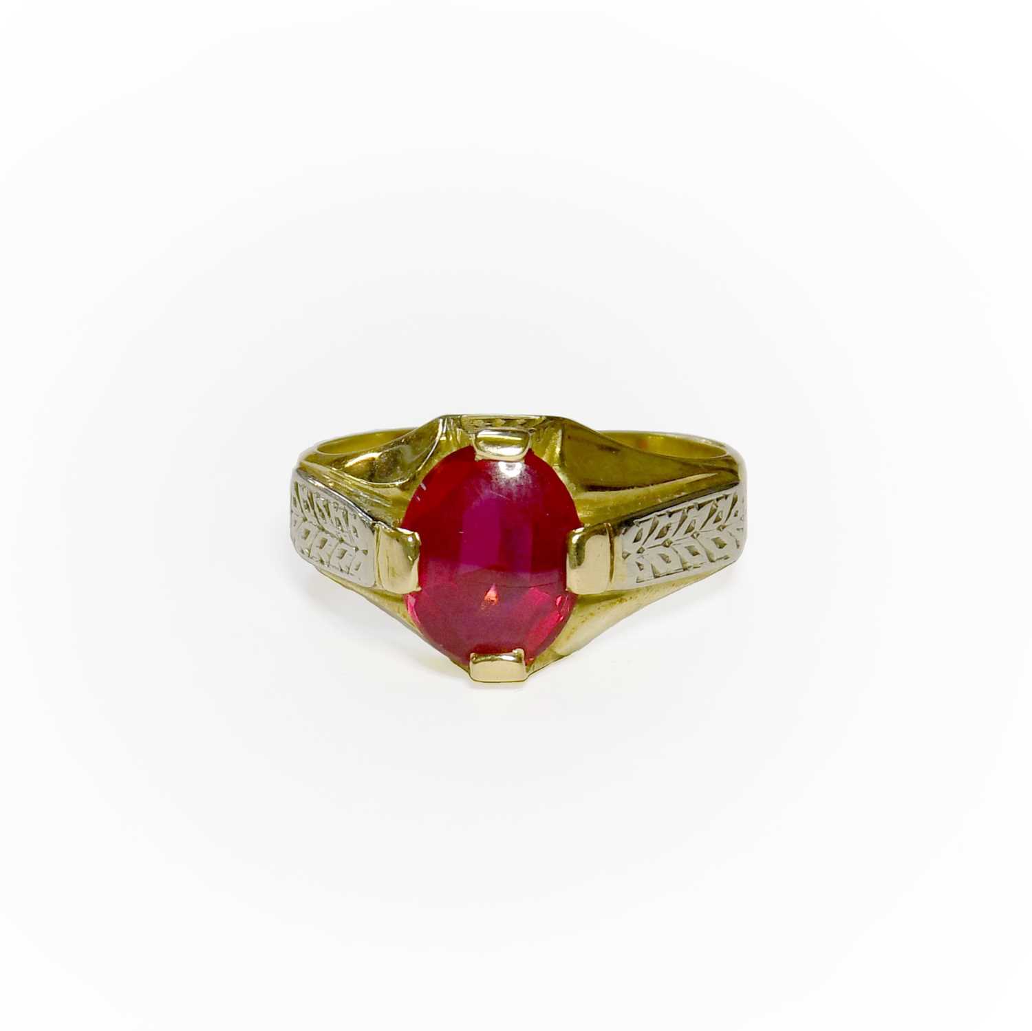 Lot 30 - A Synthetic Ruby Ring, the oval synthetic ruby...