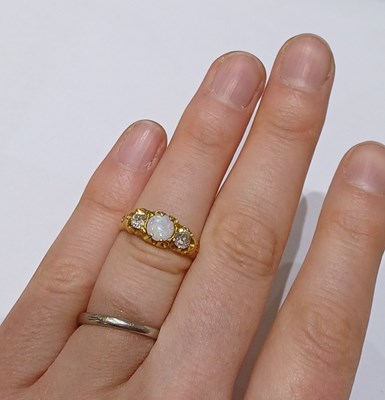 Lot 23 - An Opal and Diamond Three Stone Ring, the...