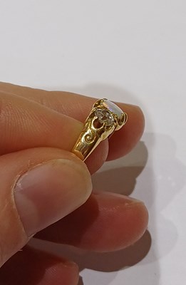 Lot 23 - An Opal and Diamond Three Stone Ring, the...